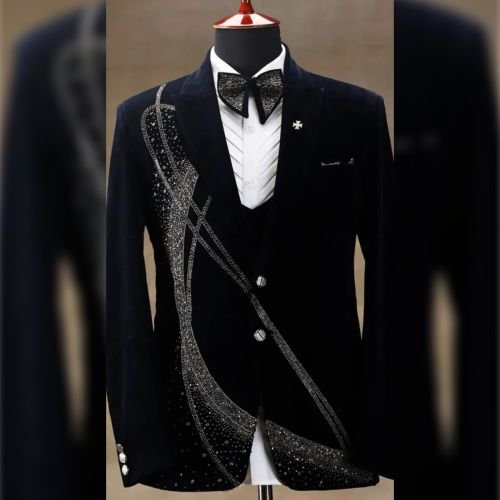 Tailor pinning a fitting on a jacket